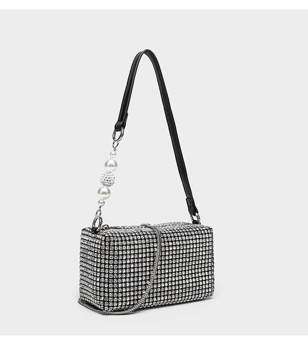 Small rectangular all-over rhinestone crossbody bag with pearl bead zipper pull and detachable silver chain strap, detail