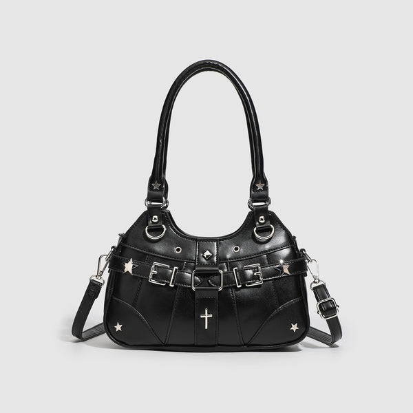 Small structured glossy leather-look crossbody bag with star-stud hardware, buckle strap detail, zip closure, and detachable