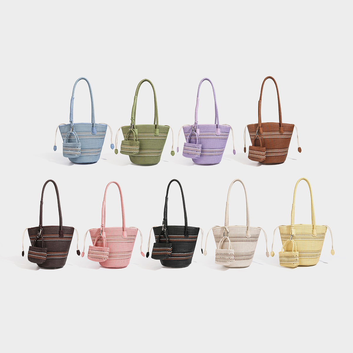 Light blue open-weave woven bucket tote bag with long braided shoulder straps, drawstring side ties, and attached mini pouch