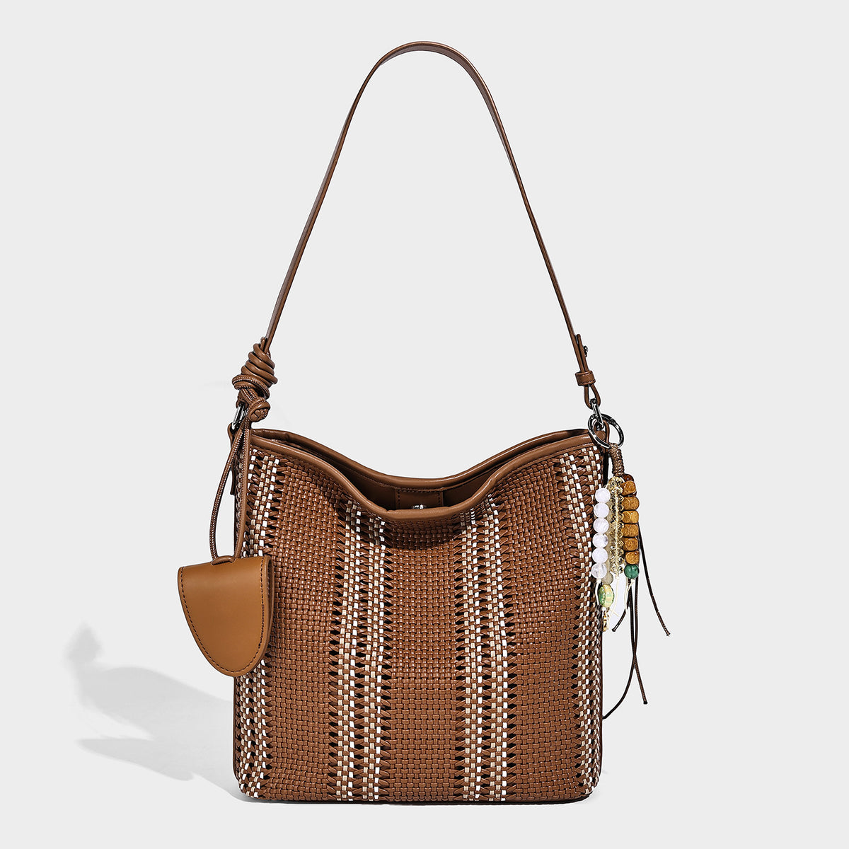 Woven bucket shoulder bag with leather-look trim, silver-tone hardware, and beaded tassel charm, detail view 10