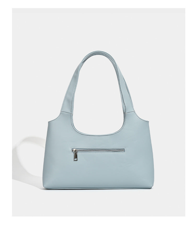 Powder blue structured tote bag with dual front flap buckle pockets and silver-tone hardware, detail view 12