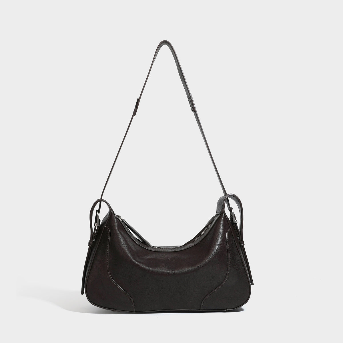 Dark brown curved zip-top hobo shoulder bag with slim adjustable strap and silver-tone hardware, detail view 7