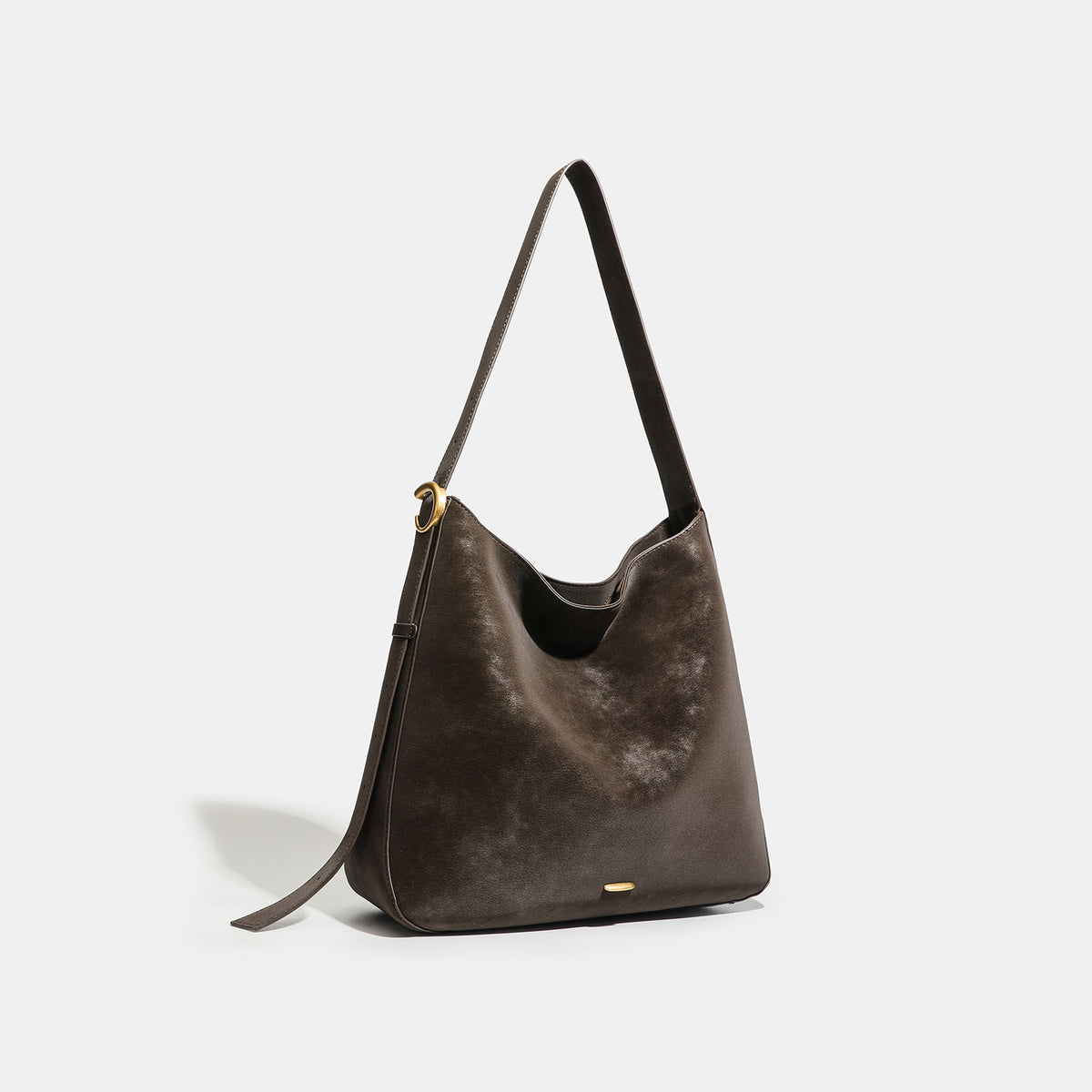 Large slouchy hobo tote bag in distressed dark brown leather-look finish with long shoulder strap, gold-tone ring hardware