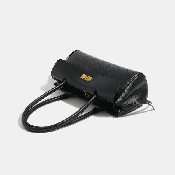 Structured quilted diamond-stitch baguette handbag with gold-tone turn-lock closure and dual top handles, detail view 4