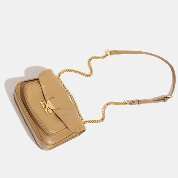Smooth leather-look flap crossbody bag with chunky gold-tone chain strap and double-knob twist lock, detail view 4
