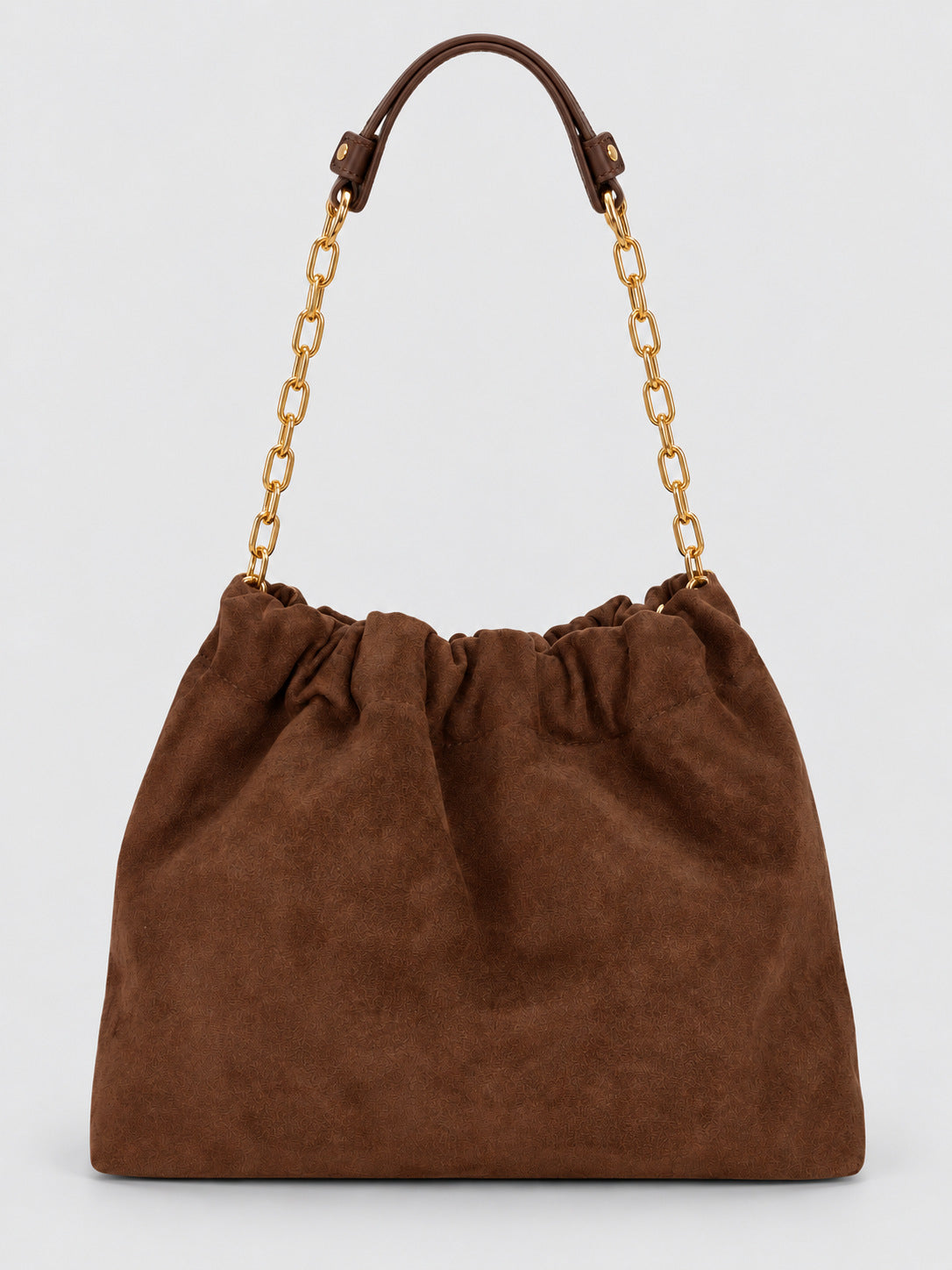Slouchy suede-look shoulder bag with gathered top, angular stitched paneling, and chunky gold-tone chain strap, detail view