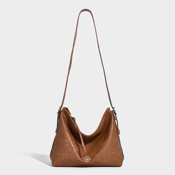 Slouchy leather-look hobo shoulder bag with gold-tone hardware and adjustable strap in brown, detail view 25