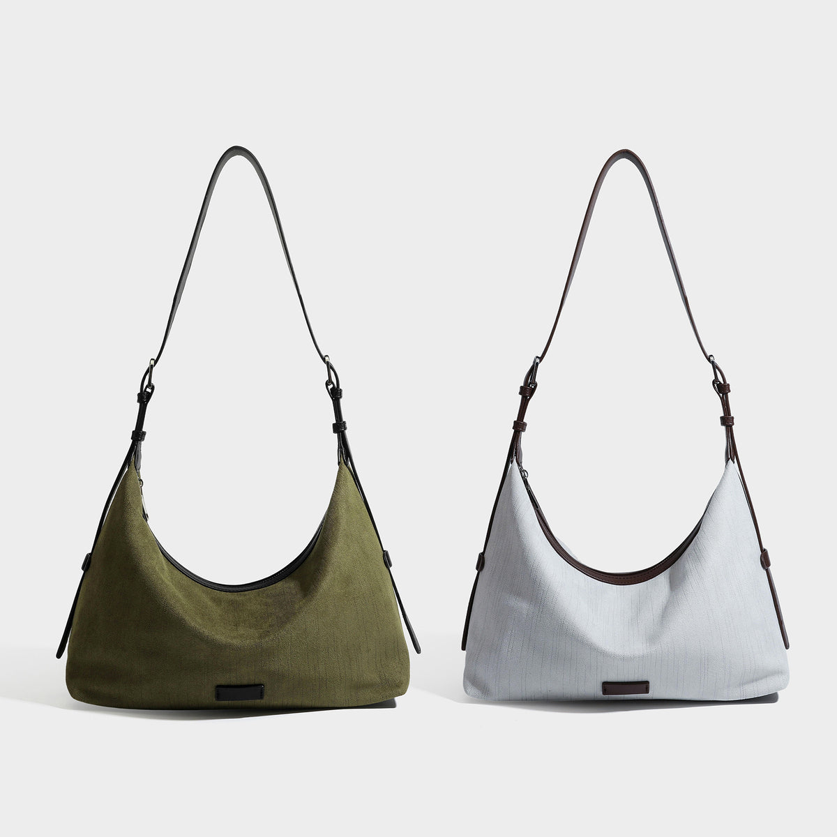 Slouchy olive green canvas hobo shoulder bag with black leather-look trim, zip-top closure, and adjustable strap, detail view