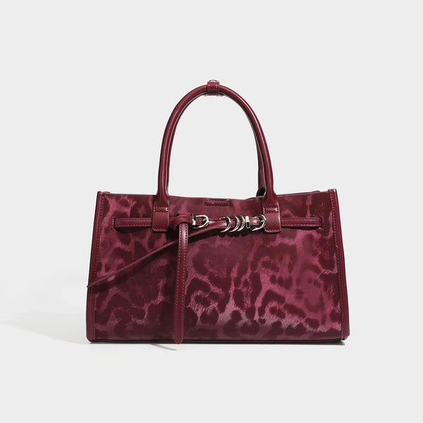 Structured leopard-print tote bag with glossy satin-like finish, dual rounded top handles, silver buckle-and-ring front