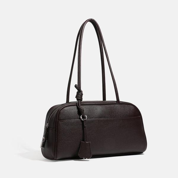 Structured rounded rectangular shoulder bag with pebbled leather-look finish, dual long handles, top zipper, front zip