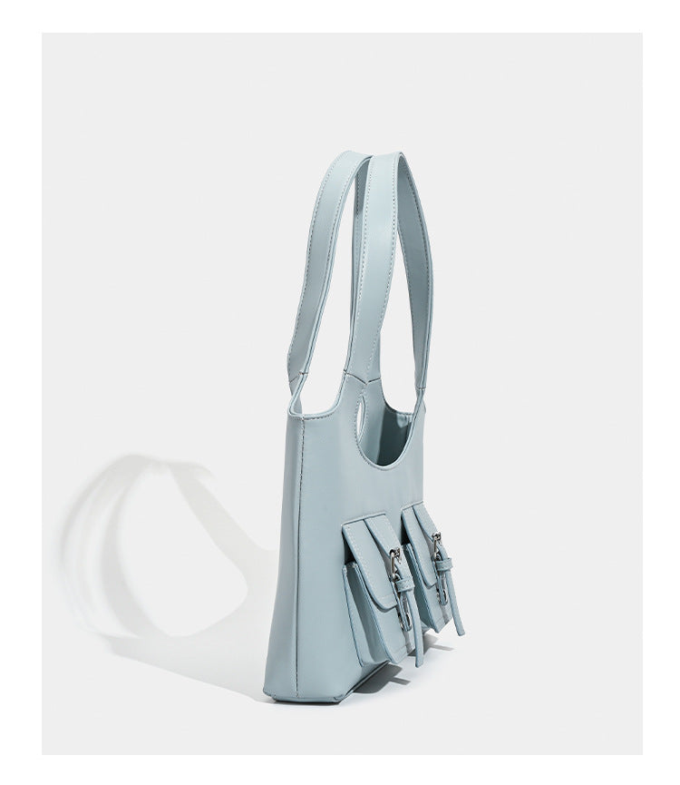 Powder blue structured tote bag with dual front flap buckle pockets and silver-tone hardware, detail view 11