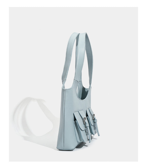 Powder blue structured tote bag with dual front flap buckle pockets and silver-tone hardware, detail view 11