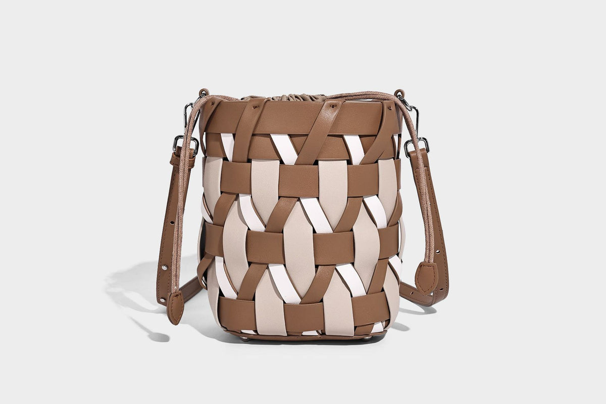 Small woven lattice bucket bag in tan and cream leather-look strips with drawstring top and detachable crossbody strap