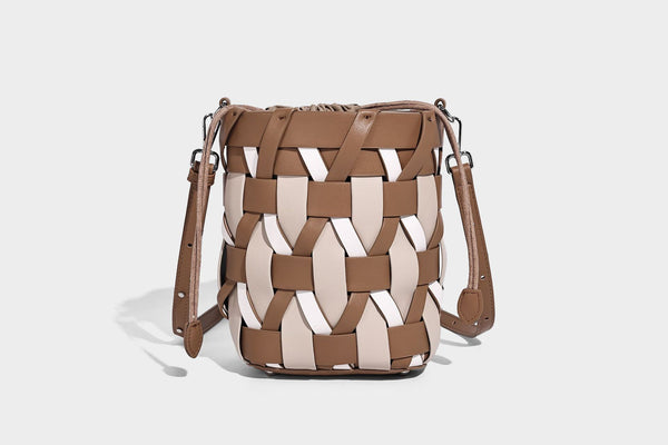 Small woven lattice bucket bag in tan and cream leather-look strips with drawstring top and detachable crossbody strap