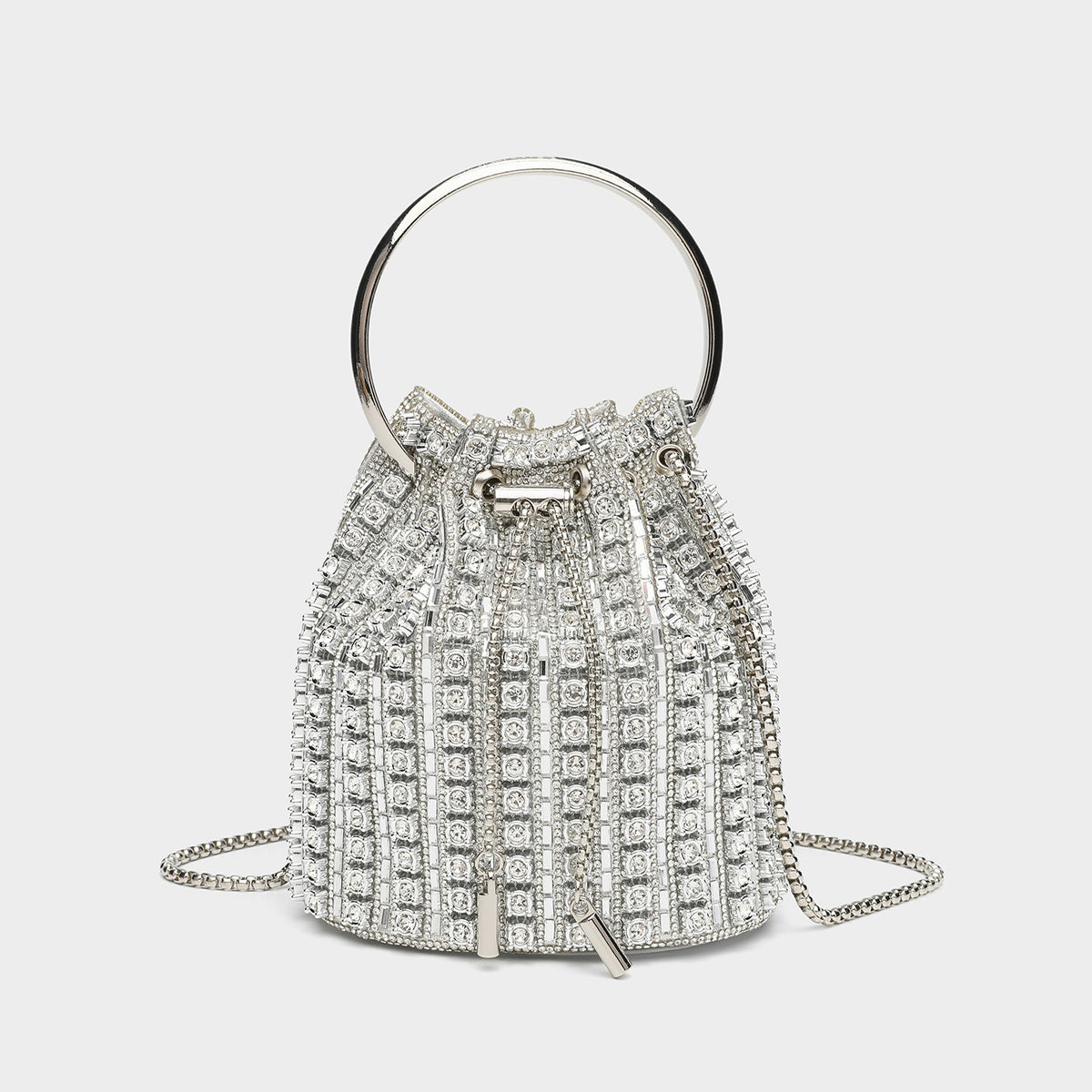 Mini crystal rhinestone bucket bag with circular ring top handle, drawstring closure, and silver chain shoulder strap, front