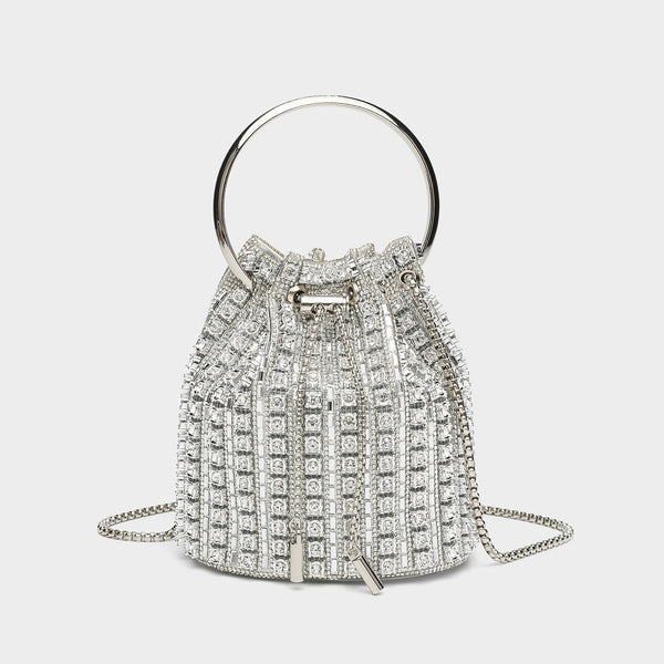 Mini crystal rhinestone bucket bag with circular ring top handle, drawstring closure, and silver chain shoulder strap, front
