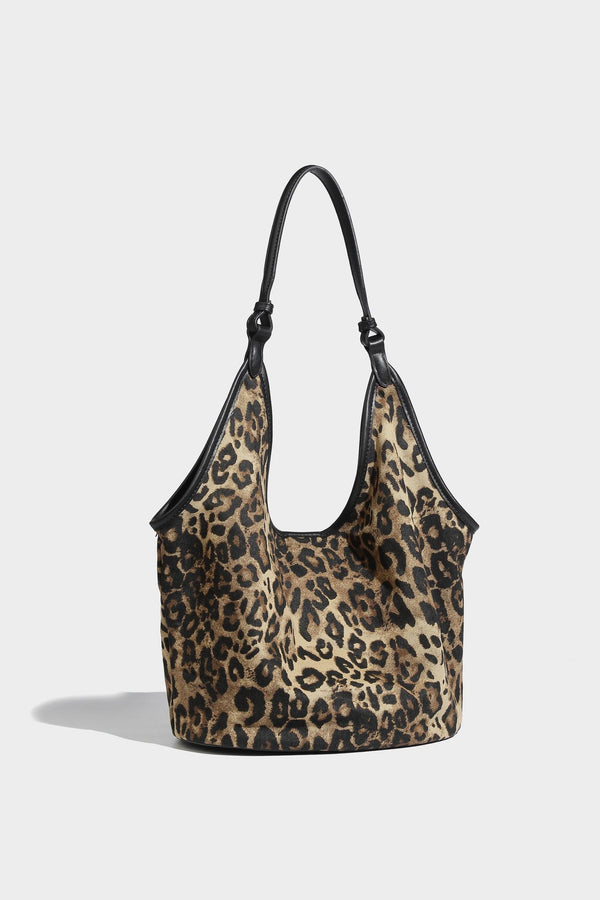 Slouchy brown leopard jacquard hobo tote bag with black leather-look trim and single shoulder strap, shown with black, detail
