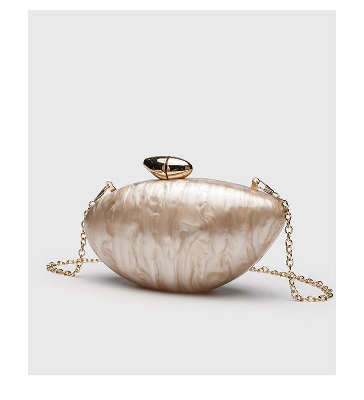 Oval hard-shell marbled gloss clutch bag with gold-tone kiss-lock clasp and detachable gold chain strap, detail view 14