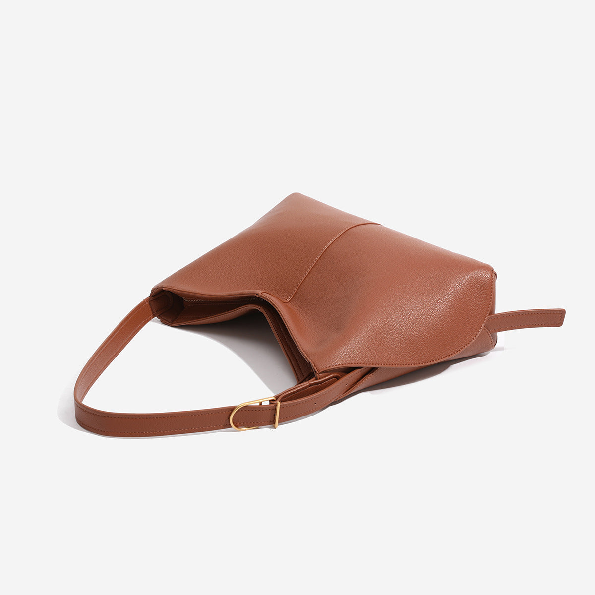 Soft pebbled leather-look hobo shoulder bag with crescent dipped opening, central seam, and adjustable strap, detail view 4