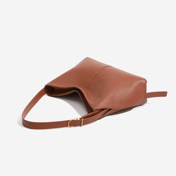 Soft pebbled leather-look hobo shoulder bag with crescent dipped opening, central seam, and adjustable strap, detail view 4