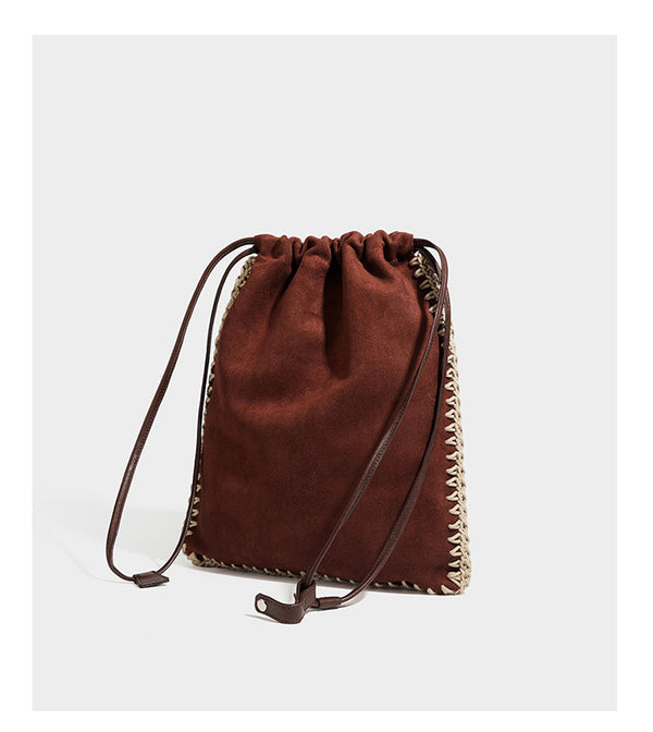 Matte suede-look drawstring bucket bag with cream braided woven edge trim and slim adjustable leather-look shoulder strap