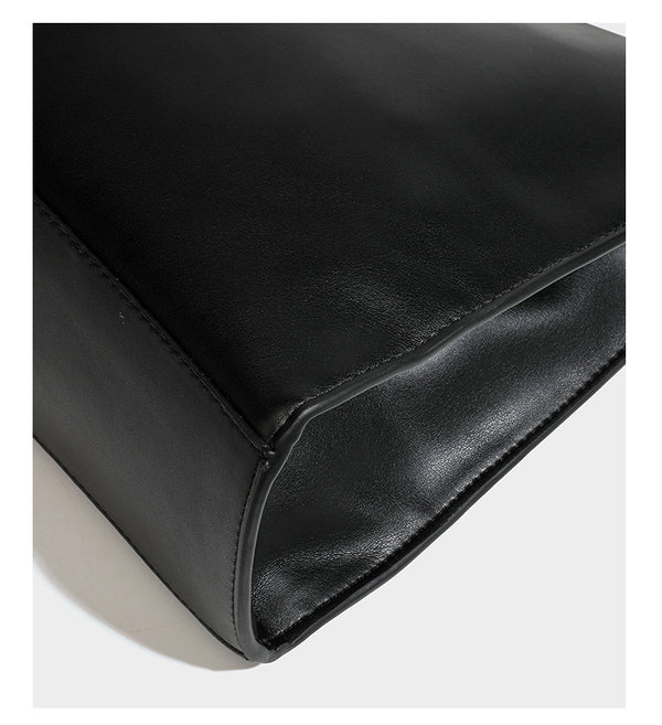 Structured rectangular shoulder tote bag with smooth leather-look finish, long double straps, and gold-tone gourd emblem on