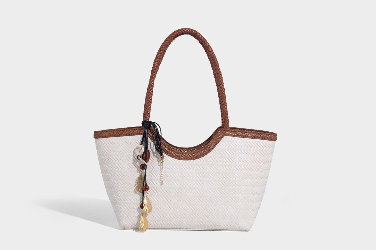 Large open-top woven tote bag with contrasting braided double handles and matching drawstring pouch, detail view 21