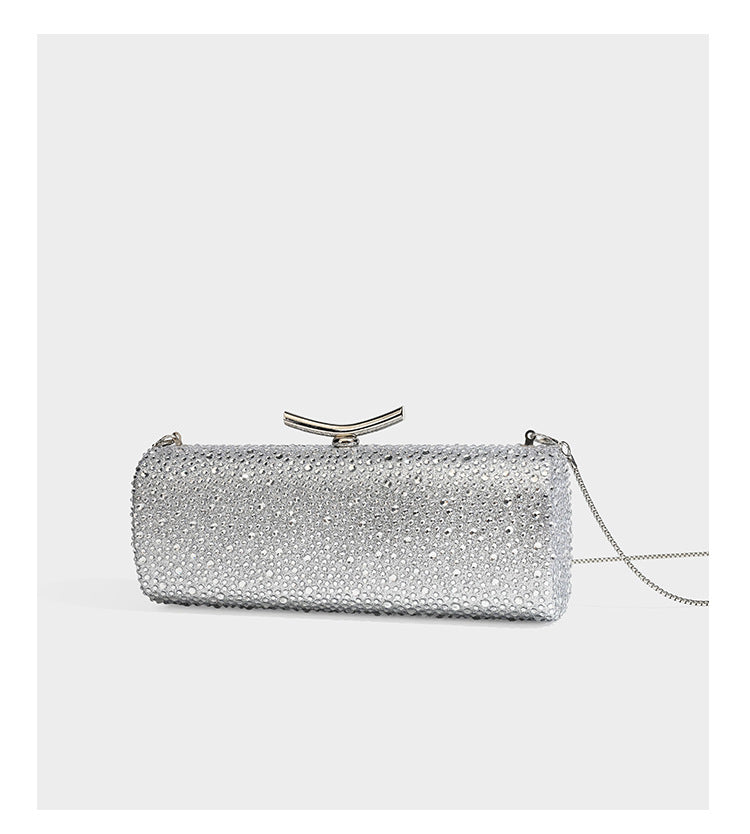 Structured rectangular hard-case clutch bag covered in all-over rhinestone crystal embellishment with curved kiss-lock top