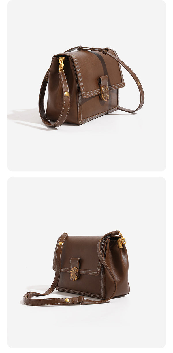 Structured flap shoulder bag with gold-tone circular turn-lock closure, white contrast stitching, and adjustable strap