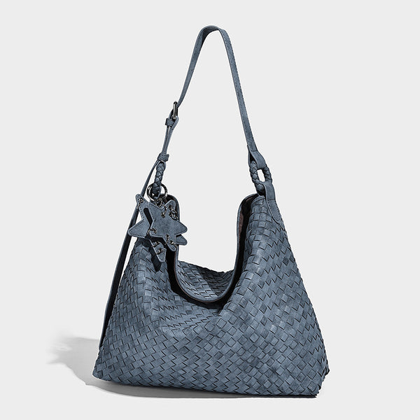 Large soft woven hobo shoulder bag with matte textured finish, adjustable strap, and star charm hardware, detail view 3