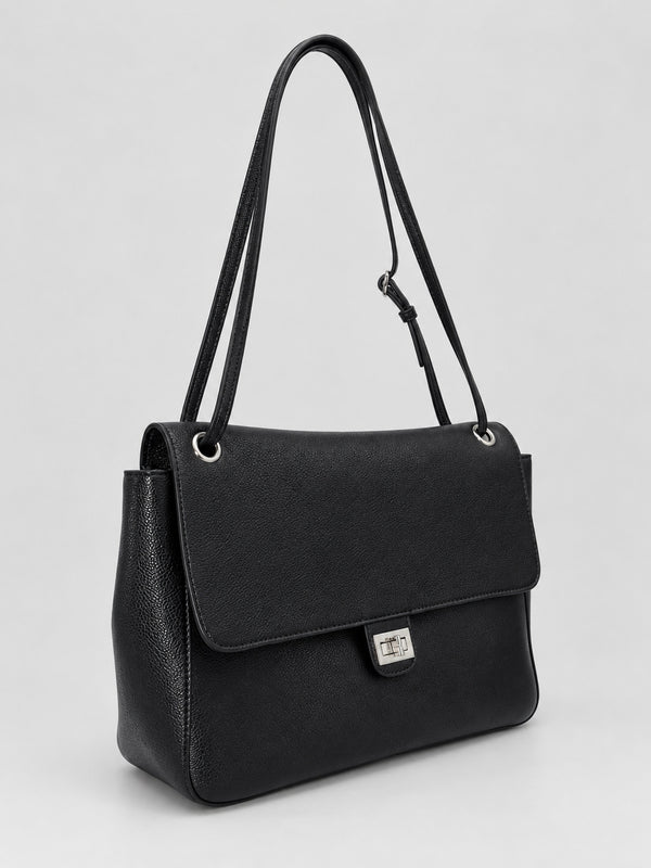 Structured black flap shoulder bag with pebbled texture, silver-tone turn-lock closure, and adjustable single shoulder strap