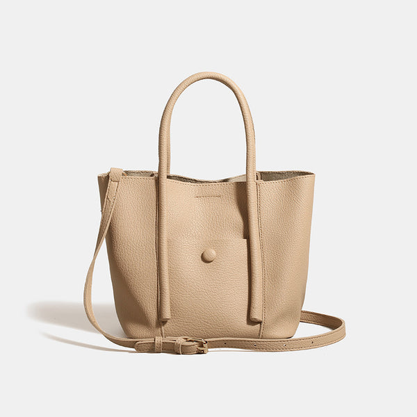 Structured pebbled matte tote bag with front snap pocket, dual top handles, and detachable zip pouch in almond beige, detail