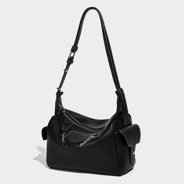 Small slouchy moto-style crossbody bag in smooth matte leather-look finish with white contrast stitching, silver-tone, front