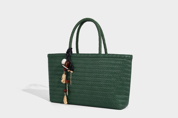 Structured woven-texture tote bag with brown braided top handles, decorative tassel charm, and detachable shoulder strap
