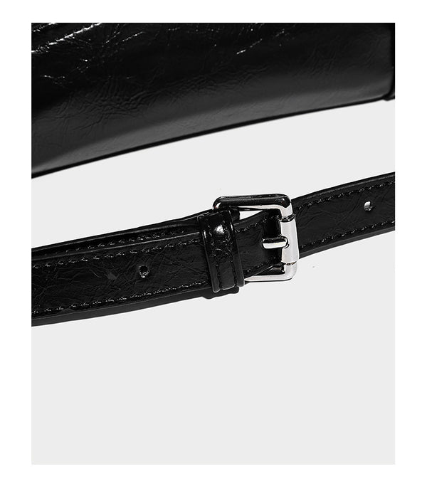 Glossy structured black tote shoulder bag with silver buckle hardware, zip pockets, dual top handles, and detachable, detail