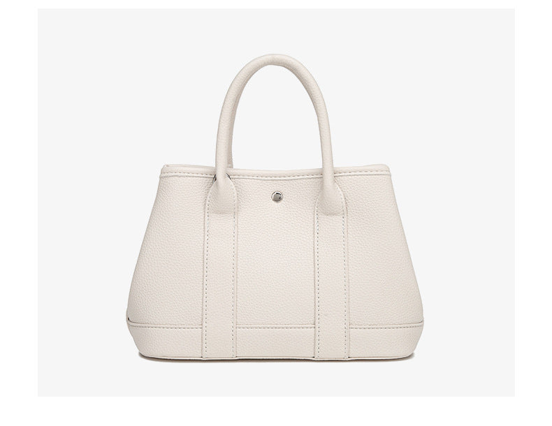 Structured pebbled leather-look top-handle tote bag with elephant charm and detachable shoulder strap, detail view 18