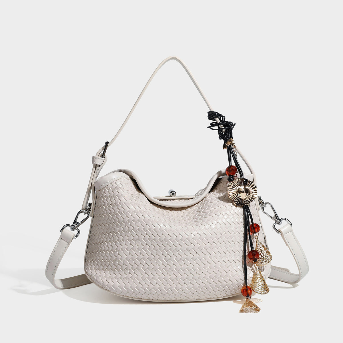 Small woven-look leather-look flap shoulder hobo bag in burgundy with silver-tone hardware and decorative tassel charm