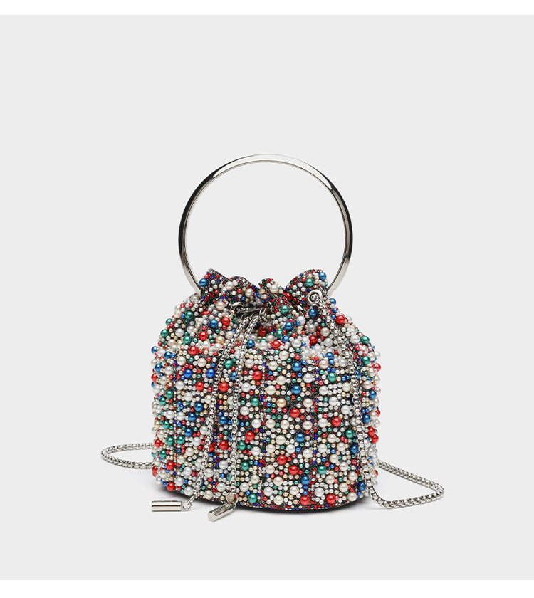 Small pearl-beaded drawstring bucket bag with silver-tone ring top handle and chain shoulder strap, detail view 15