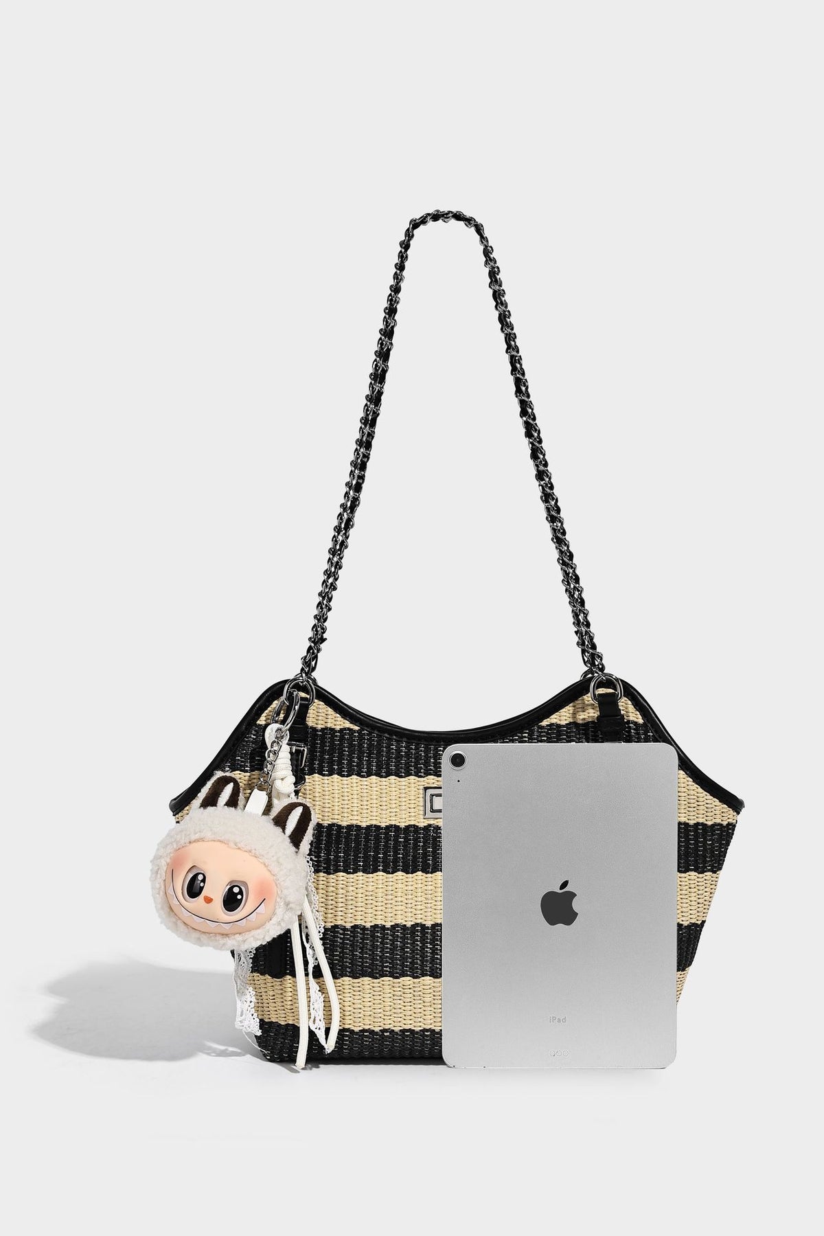Black and natural striped woven tote bag with chain shoulder strap and silver-tone turn-lock hardware, detail view 23