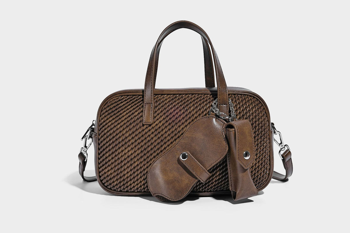Structured woven-texture front top-handle handbag with zip closure, dual handles, detachable shoulder strap, and matching