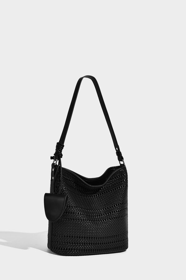 Handwoven open-weave shoulder bag with leather-look trim, knotted adjustable strap, and clip-on sunglasses sleeve pouch