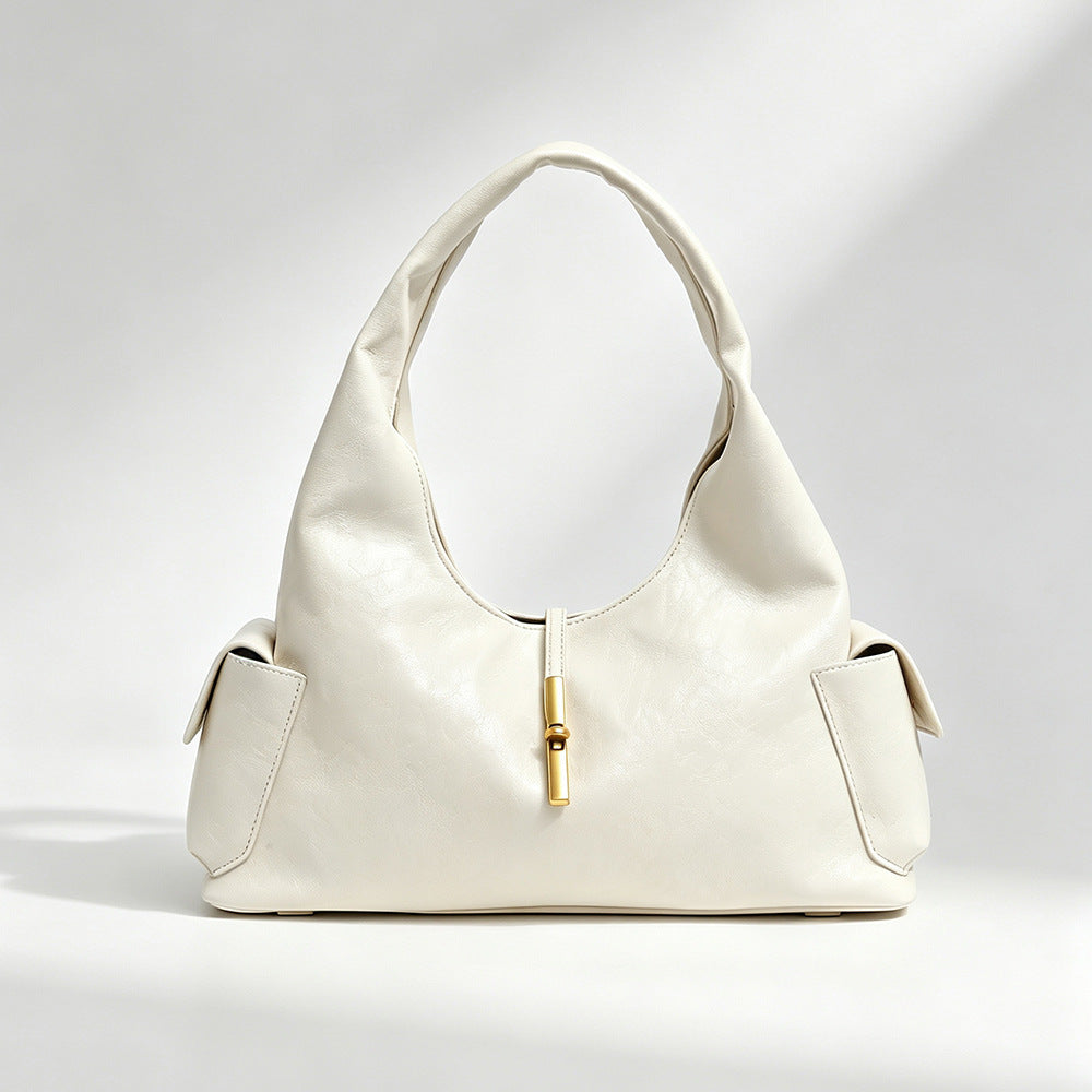 Slouchy leather-look hobo shoulder bag with gold-tone bar clasp and crinkled glossy finish, detail view 6