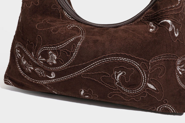 Deep chocolate suede-look hobo shoulder bag with tonal paisley floral embroidery, smooth dark leather-look trim, top zip