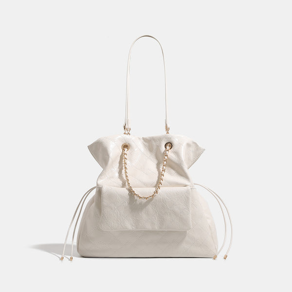 Quilted crinkled leather-look convertible tote backpack with gold-tone chain handles and drawstring closure, detail view 7