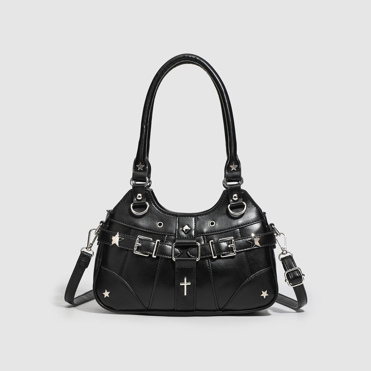Small structured glossy leather-look crossbody bag with star-stud hardware, buckle strap detail, zip closure, and detachable