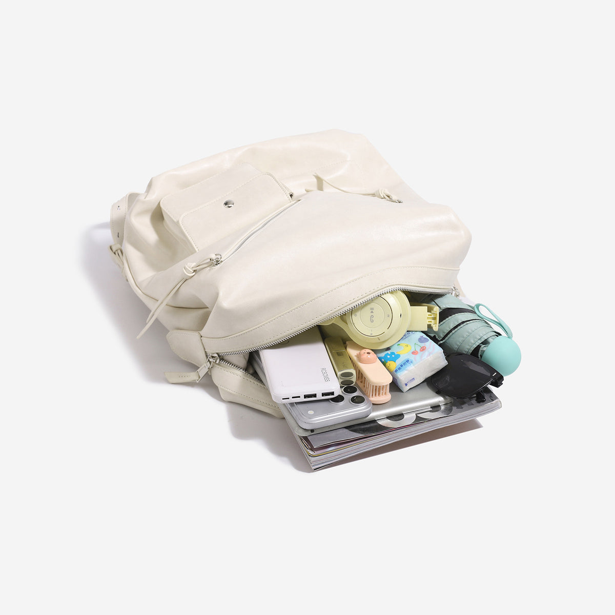 Large smooth leather-look backpack with multi-pocket front panel, dual zip closure, and silver-tone hardware, detail view 4