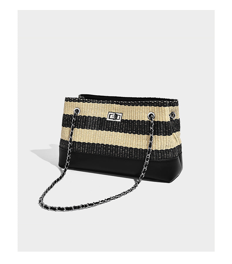 Structured black and beige striped woven shoulder bag with silver chain strap and turn-lock metal clasp, detail view 7