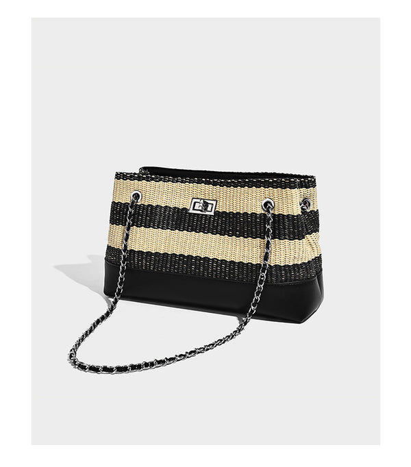 Structured black and beige striped woven shoulder bag with silver chain strap and turn-lock metal clasp, detail view 7