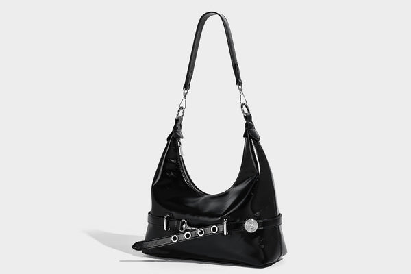 Glossy black slouchy hobo shoulder bag with silver-tone hardware, belt-style grommet strap at base, and long adjustable