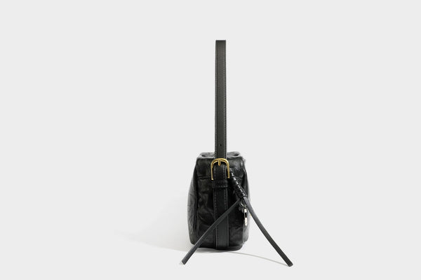 Compact black crinkled leather-look baguette shoulder bag with gold-tone arch hardware and adjustable strap, detail view 27